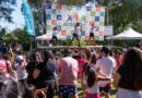 Activate Quilpué: Instructores guían baile en escenario con público activo al aire libre. Evento deportivo comunitario en Quilpué.